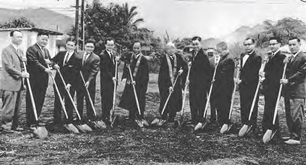 Ministers pose with shovels at the School St site prior to constuction