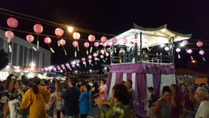 dancing around the yagura under the lanterns at night